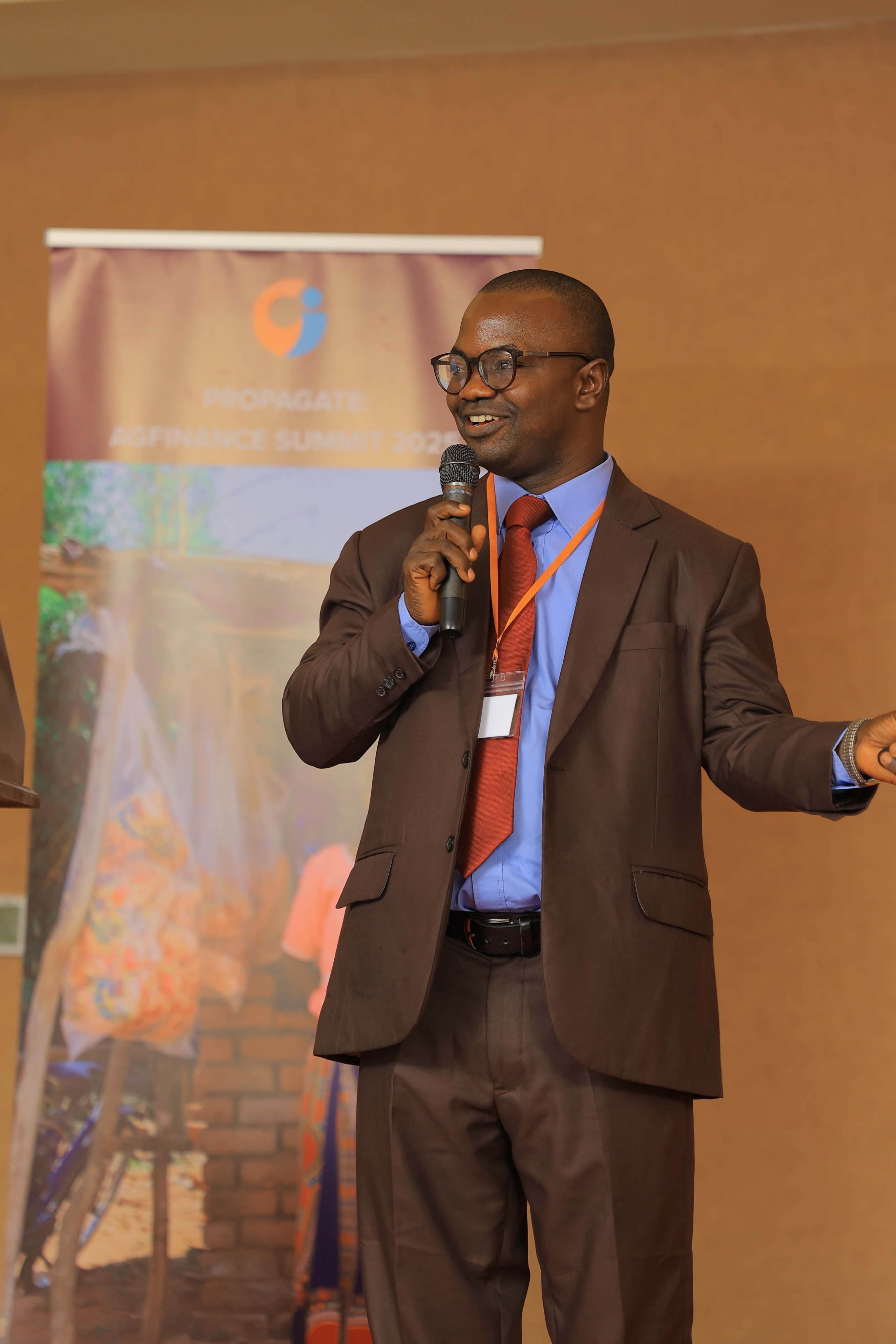 Dr. Asongo Abraham presenting on his organization’s women’s strategy.  