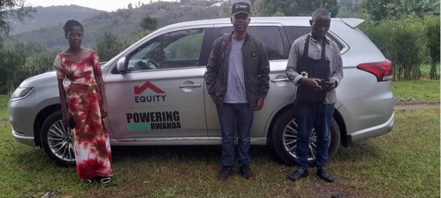 OI AgFin FSA, Jackson (middle), with two group members that opened accounts with Equity Bank Huye.