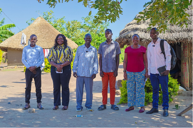 Part of the AgFinance MERL team meeting with some farmers in Uganda.
