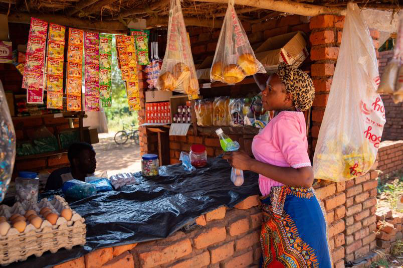 AgFinance client Patricia at her grocery business in Malawi. 