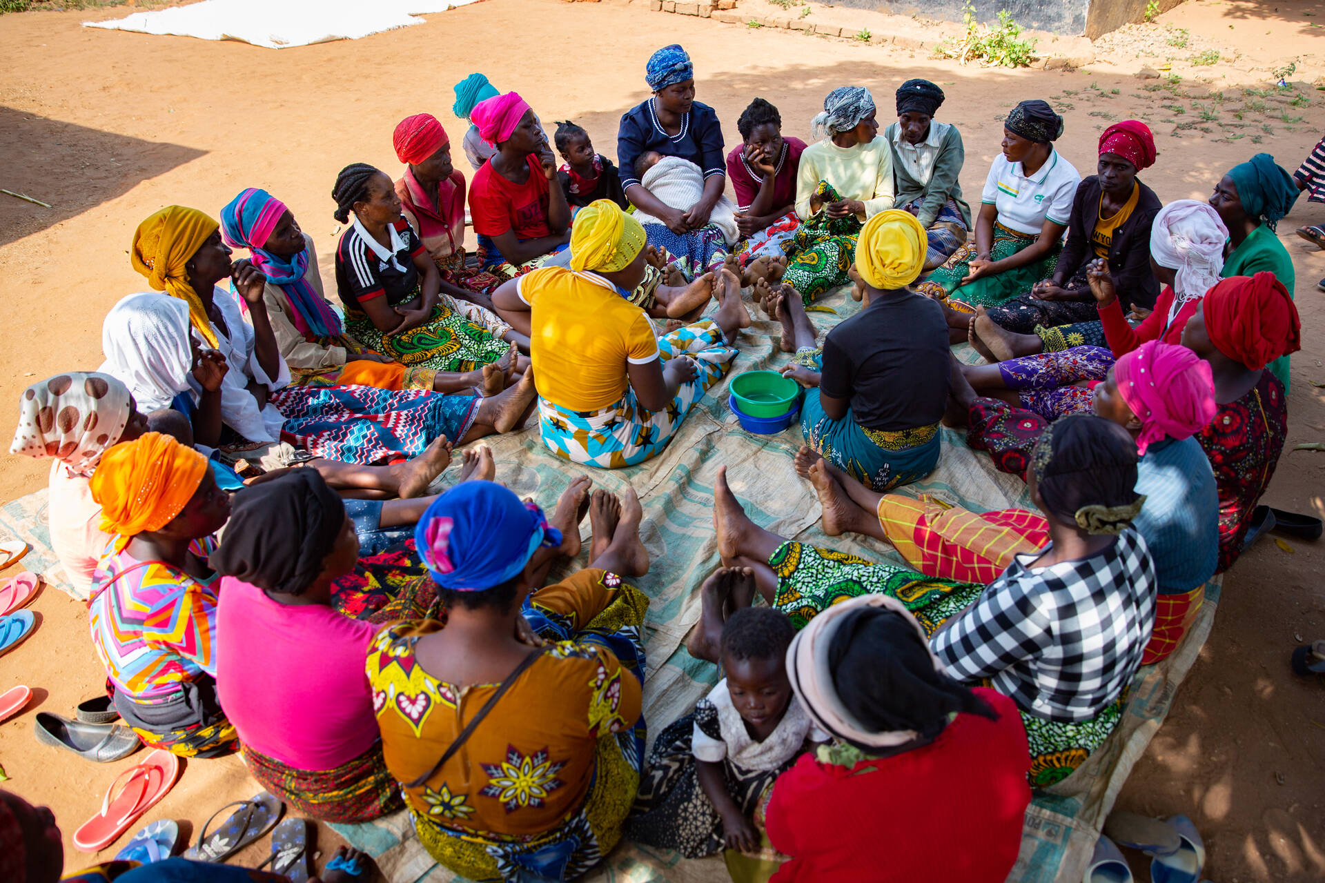 Money is paid into the VLSA pot in Zomba, Malawi. (Photo credit: Eden Sparke / Opportunity International)